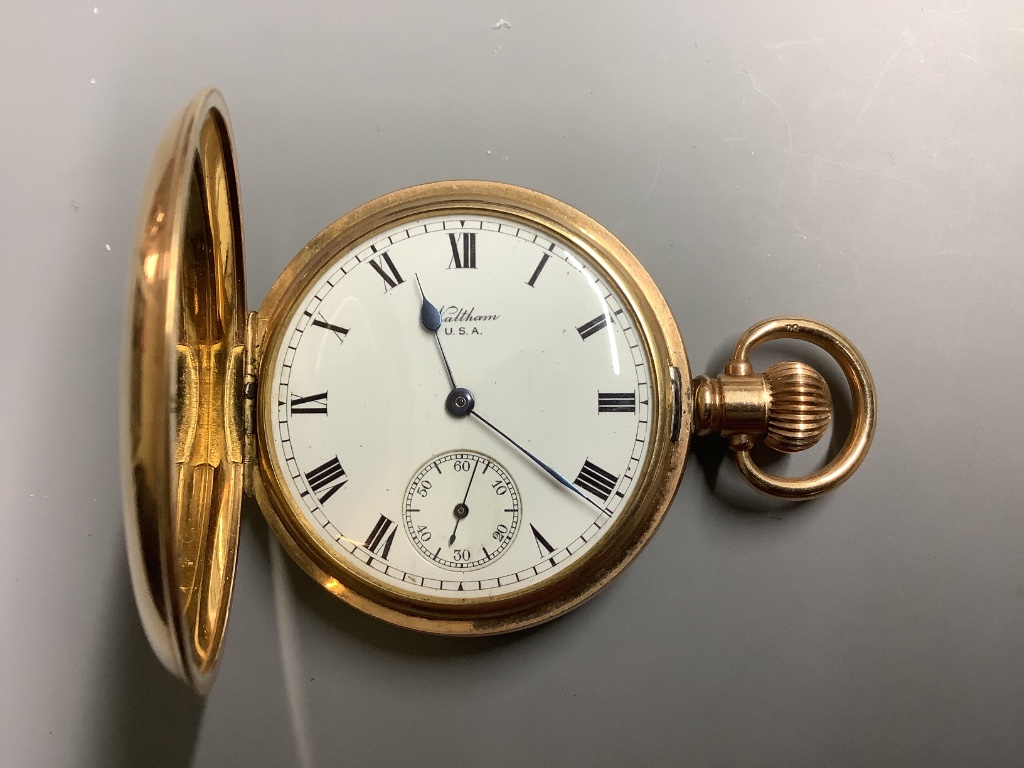 A gold plated Waltham hunter pocket watch.